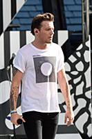 Louis Tomlinson of One Direction performs on Good 