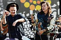 Harry Styles and Liam Payne of One Direction perfo