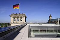 Germany, Berlin, German flag fluttering on a corne