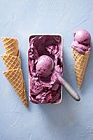 Homemade blueberry ice cream and waffle cones