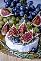 Cheese Camembert with figs, honey, grapes and frag