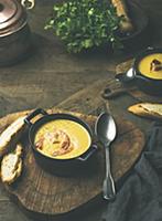 Corn creamy soup with shrimps served in individual